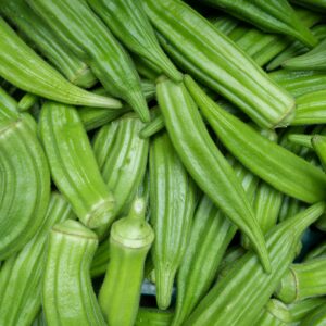 Close-up of fresh green okra pods, showcasing their vibrant color and texture.